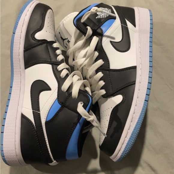 black, white, university blue air Jordan 1 mid’s.